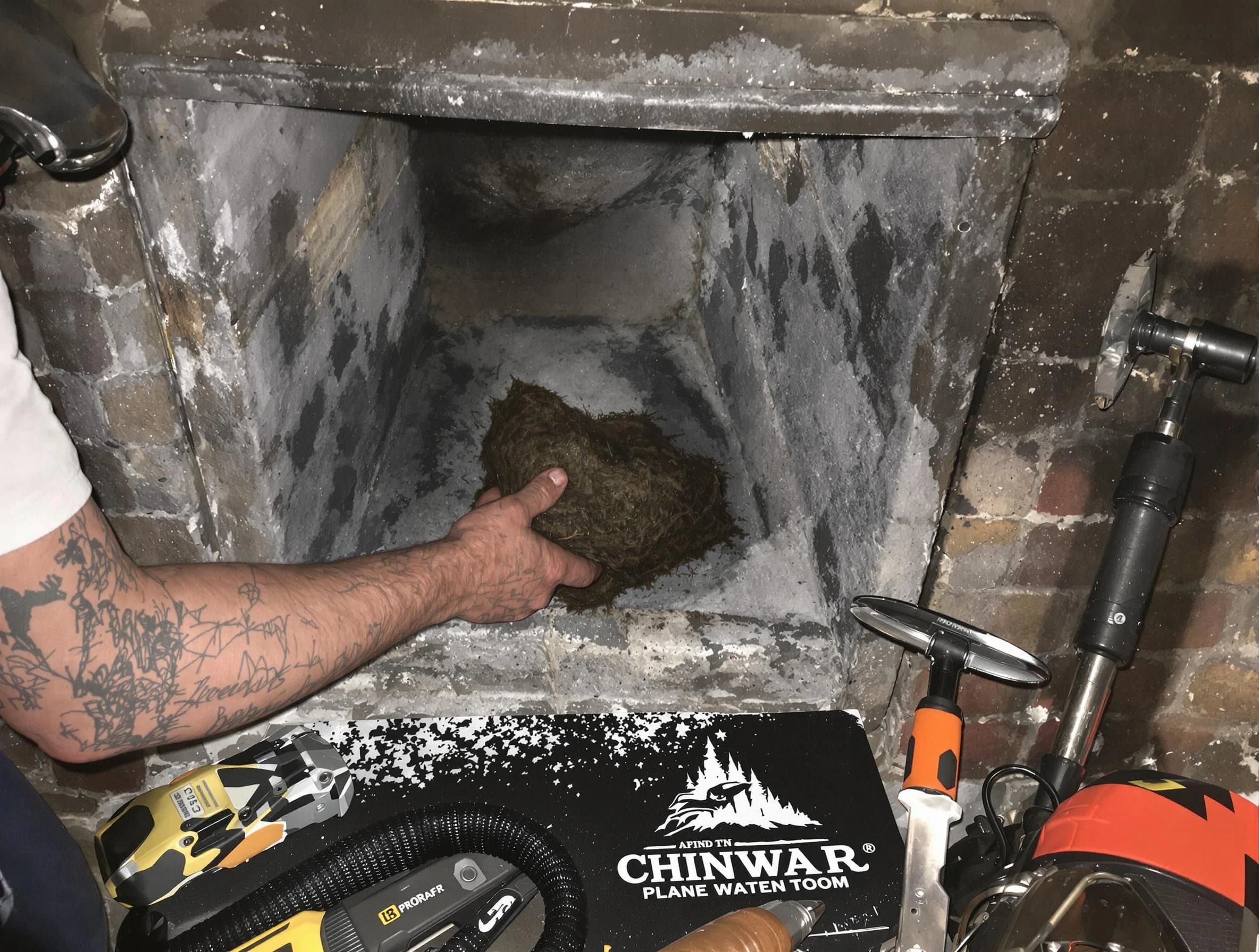 Lexington Chimney Sweep safely removing debris and screening chimney in Lexington, MA